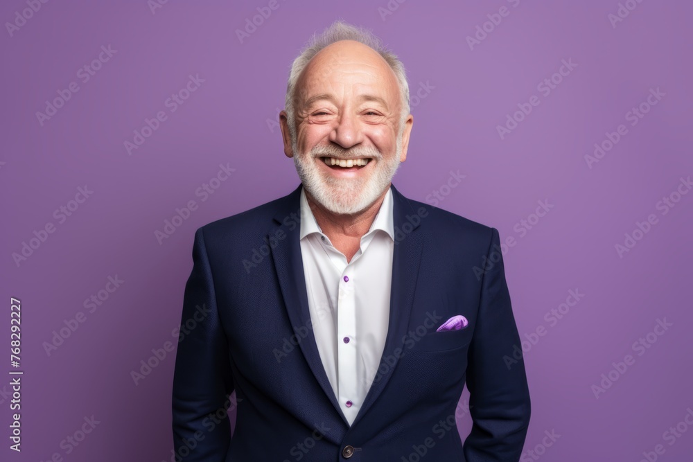 Portrait of happy senior man in suit. Isolated on purple background Portrait of happy senior man in suit. Isolated on purple background