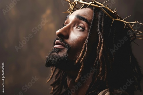 A man with dreadlocks and a cross on his head