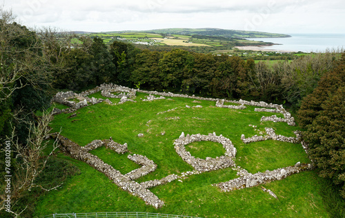 Din Lligwy Iron Age Roman enclosure settlement. Round house and metal workshop foundations. Near Moelfre, Anglesey, north Wales, UK. Looking N.W. photo