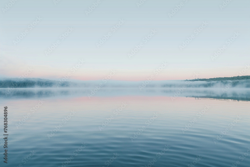 a serene lake at dawn, the surface like a mirror of silk reflecting the soft colors of the sky
