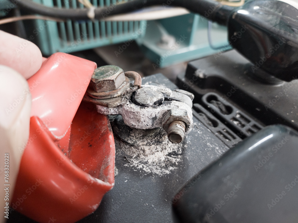 Terminal battery broken,The white powder that is on the head of the car ...