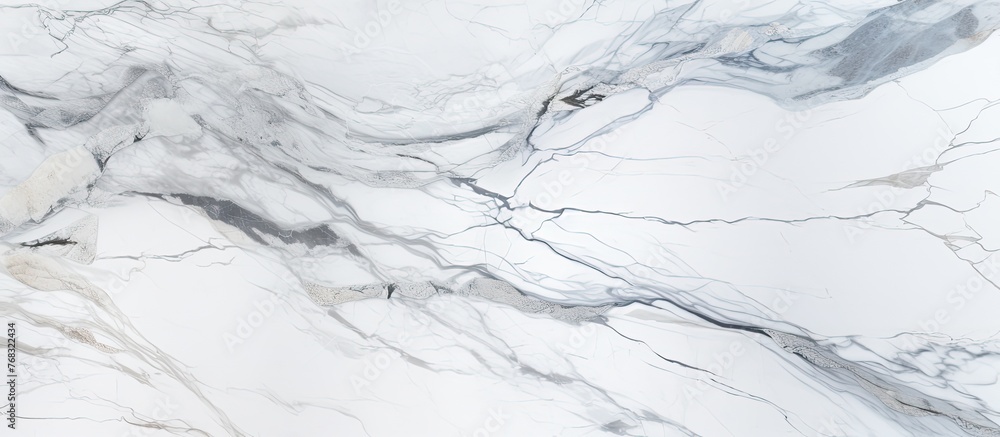 A closeup of grey marble texture resembling snow covering a slope. The intricate lines and patterns could be mistaken for a piece of art or a detailed drawing A closeup of grey marble texture resembling snow covering a slope. The intricate lines and patterns could be mistaken for a piece of art or a detailed drawing