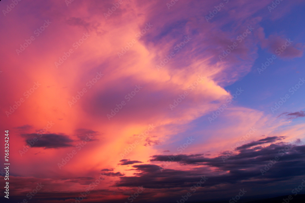 Colorful clouds at sunset. dance of clouds. purple and pink colored clouds. Dramatic and romantic sky.