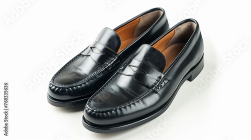 Pair of sleek black leather loafers, perfectly polished and isolated against a pristine white background.