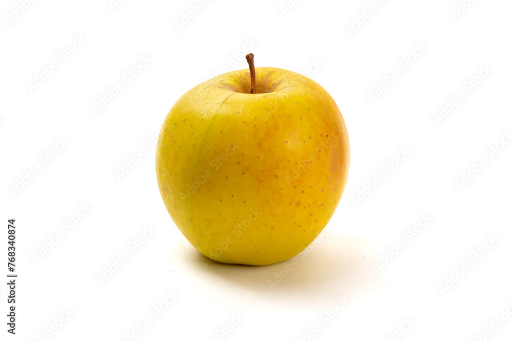A single ripe yellow Golden Delicious apple isolated on white