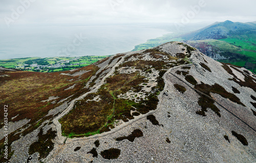 Tre’r Ceiri Iron Age settlement hillfort on Llyn Peninsula, north Wales. 200 BC through 400 AD. Massive 4m walls and stone hut circles. Looking north photo