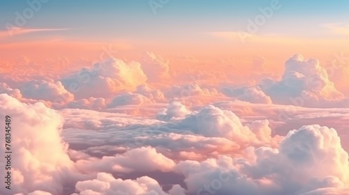 Beautiful aerial view above clouds at sunset. Flying above clouds