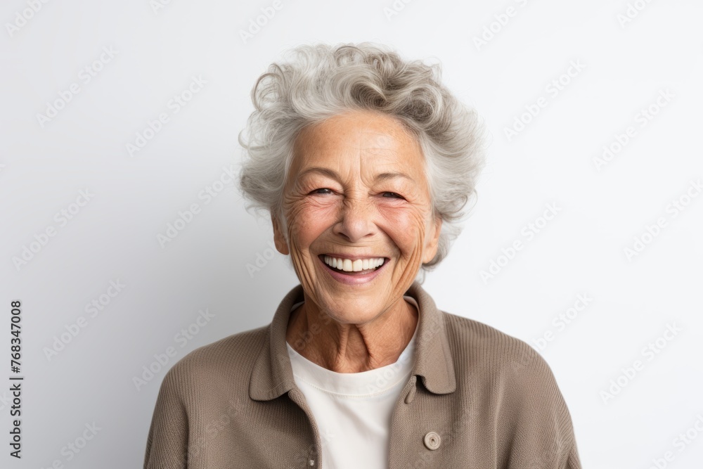 Portrait of a happy senior woman laughing and looking at the camera Portrait of a happy senior woman laughing and looking at the camera