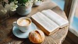 Wooden table with open bible, cup of coffee and bread