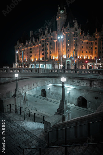 Staircase at Confederation Square leading to the Rideau Canal, with Wellington Street and the historic Fairmont Chateau Laurier hotel in the backdrop, downtown Ottawa at night, Ontario, Canada.
