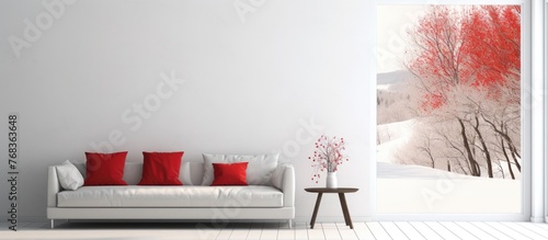 An interior design featuring a white couch with red pillows, a wooden table, a rectangleshaped chair, and a plant against a white wall photo