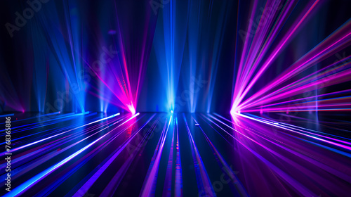 A bright blue and purple light show with a dark background. The lights are arranged in a way that creates a sense of depth and movement. The scene is energetic and dynamic