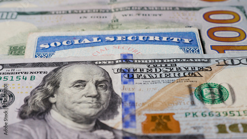 Photo of social security card with one hundred dollar bills photo