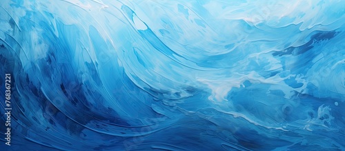 A closeup of a swirling pattern of electric blue and white paint resembling a wind wave in the ocean, creating a fluid landscape painting