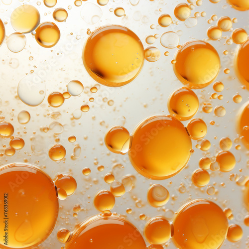 Golden-tinted translucent emulsion texture with oil bubbles for cosmetics or science use