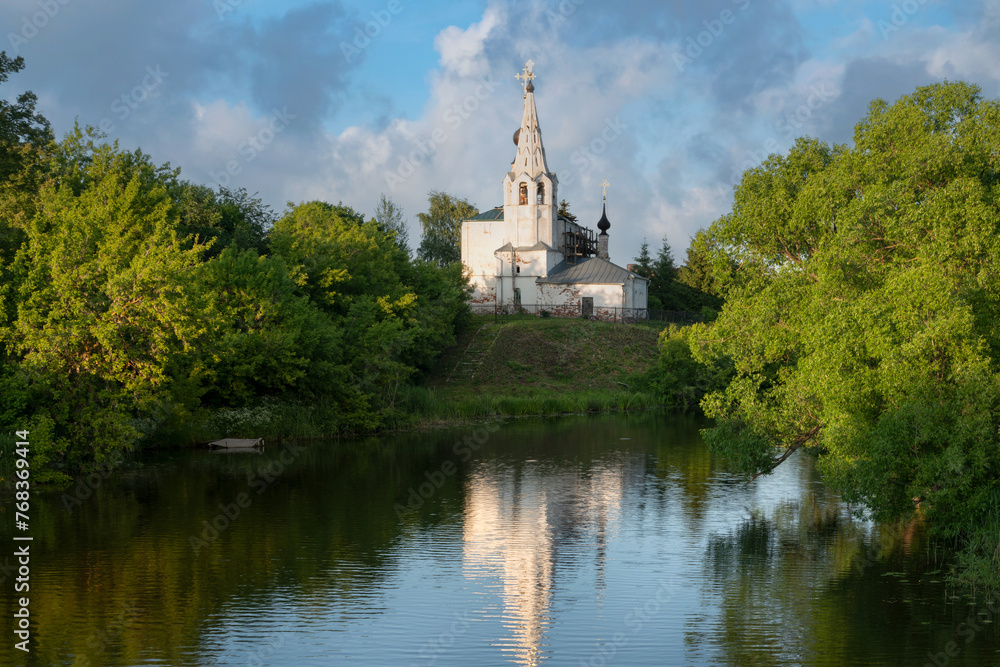 View of the Church of Cosmas and Damian on Yarunova Hill (Kozmodemyanskaya Church) on the bank of the Kamenka River on a sunny summer day, Suzdal, Vladimir region, Russia