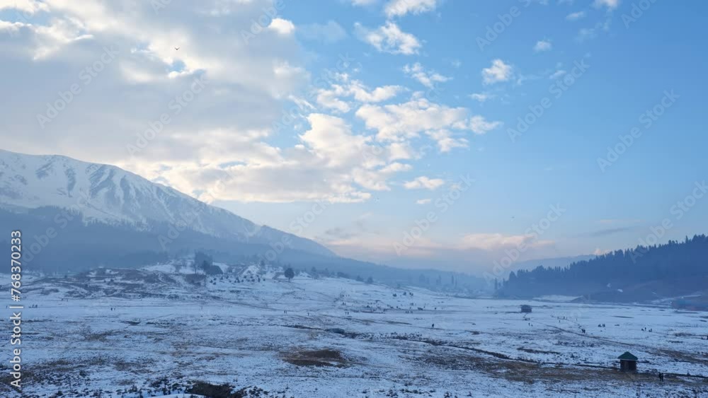 wide view of snow mountain and bird flying in gulmarg, jammu and kashmir, india. stable shot 4k wide view of snow mountain and bird flying in gulmarg, jammu and kashmir, india. stable shot 4k