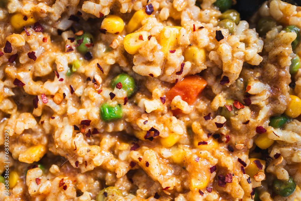 risotto primavera with peas and corn in meal prep container