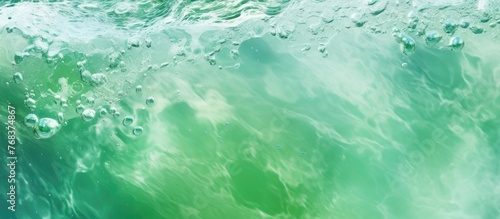 A close up of a liquid green wave in the ocean, created by the wind. The fluid pattern resembles a cumulus cloud, a unique meteorological phenomenon © TheWaterMeloonProjec