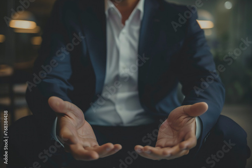 Businessman in a Suit Offering a Helping Hand in a Gesture of Support and Assurance