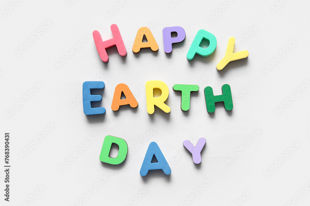 Text HAPPY EARTH DAY on white background, closeup. Earth Day celebration.
