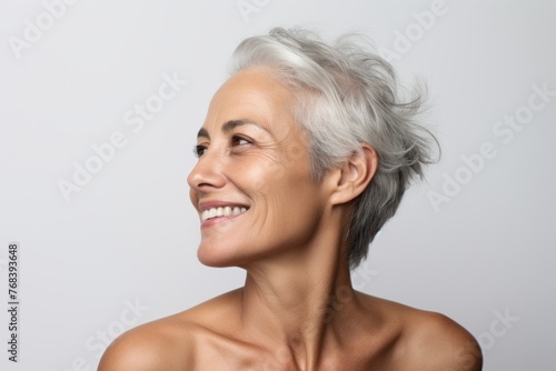 Portrait of a beautiful mature woman with grey hair and clear skin