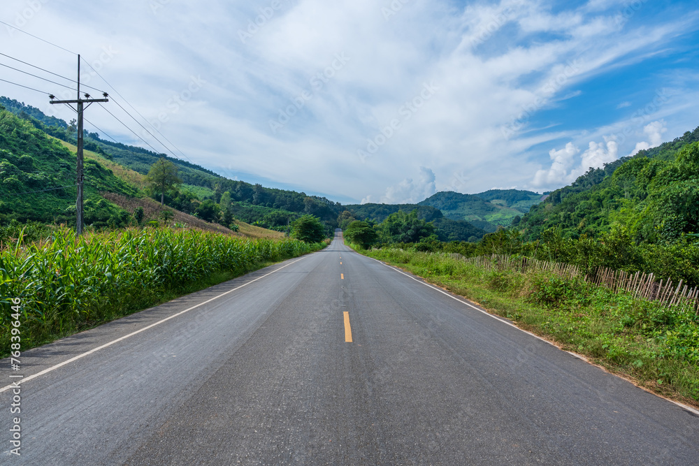 Fototapeta premium Asphalt road with blue sky in beautiful summer day