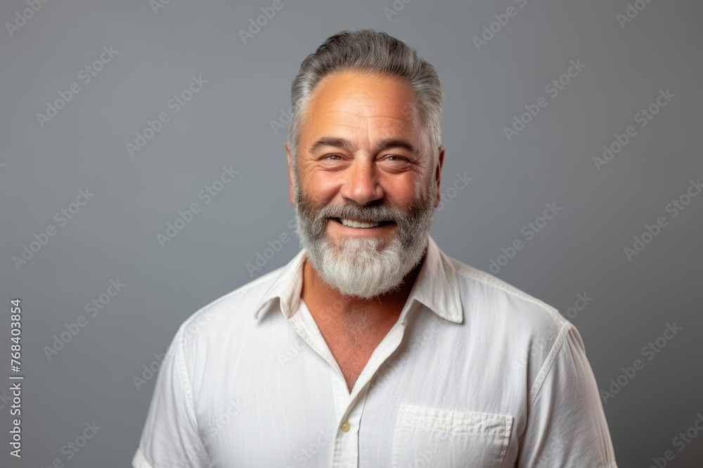 Portrait of a happy senior man with grey beard and mustache. Portrait of a happy senior man with grey beard and mustache.