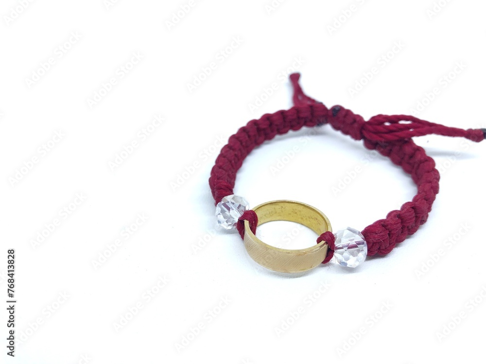 red knitted bracelet isolated on white red knitted bracelet isolated on white