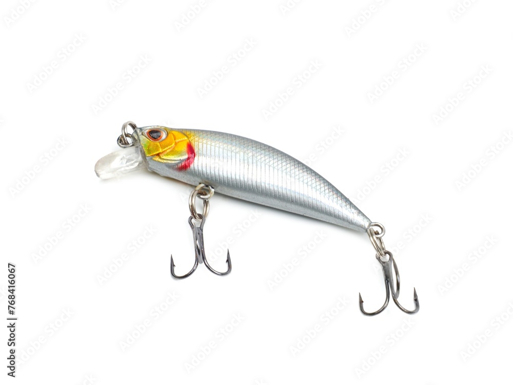 Picture of colorful fish shaped plug baits with 3 way hooks. Fishing equipment isolated on white background. Picture of colorful fish shaped plug baits with 3 way hooks. Fishing equipment isolated on white background.