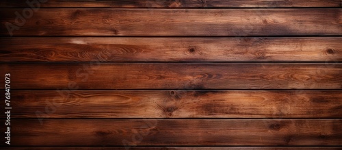 A wooden wall has a rich dark brown stain that adds depth and character to the surface