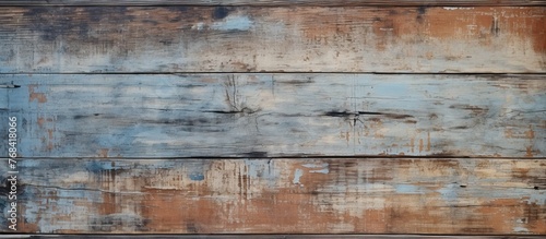 Close-up shot of a weathered wooden wall showing signs of peeling paint and wear