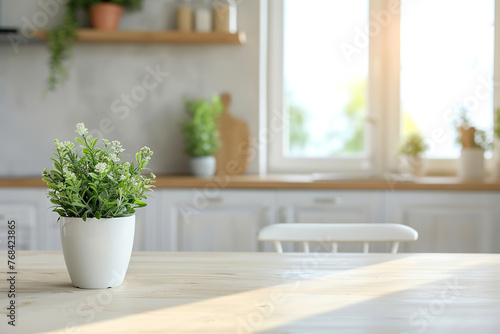 Wooden table with potted plant against kitchen window and furniture. Home cozy interior for product advertising.