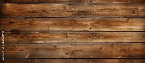 A detailed view of a weathered wooden wall made up of numerous individual planks of timber tightly fitted together