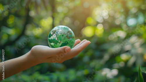 Human hand holding green earth with environmental icons sustainable environmental concept.World Environment Day. World day against drought and drought problems.