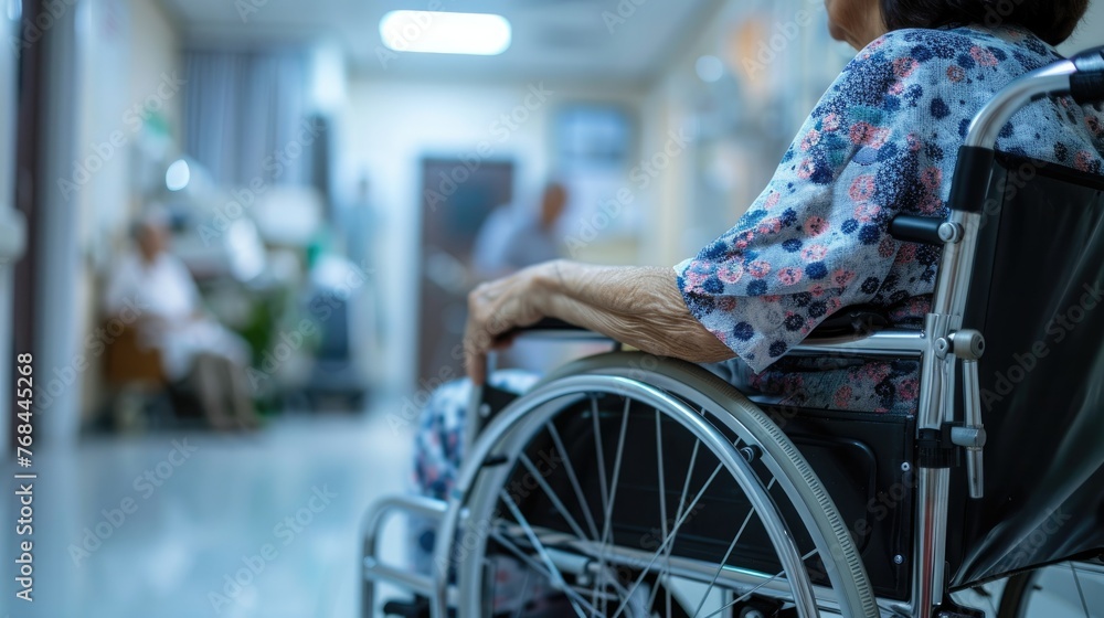 Close up of older woman sitting in wheelchair taken care of in hospital, older people disability rehab healthcare concept Close up of older woman sitting in wheelchair taken care of in hospital, older people disability rehab healthcare concept