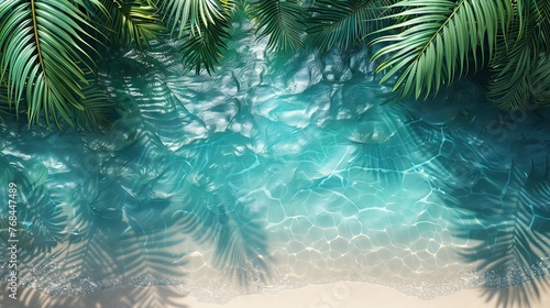 The shadow of coconut leaves on the surface of the water on the sandy beach. For summer holidays at the beach © PT