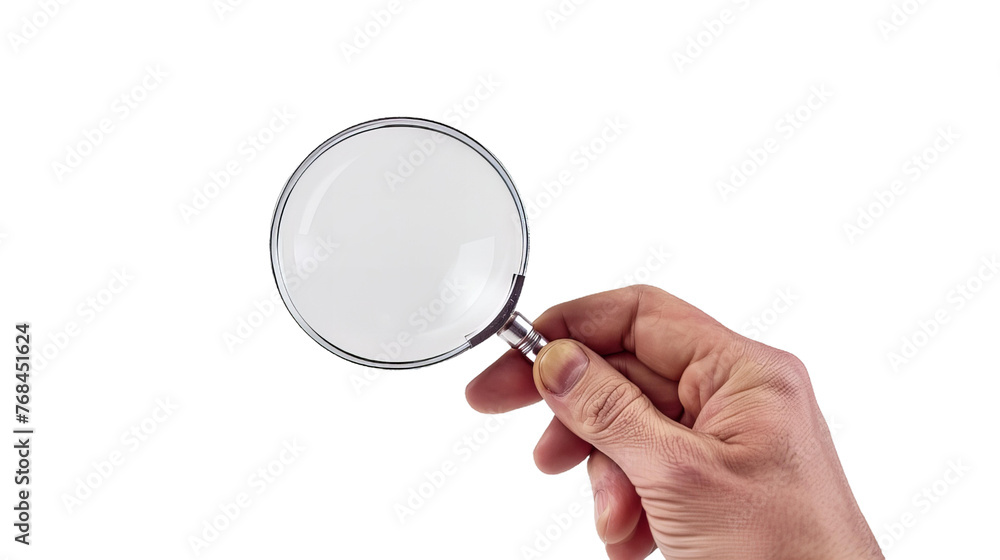 A hand holding a magnifying glass