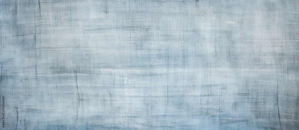 Fototapeta premium A detailed shot of an electric blue canvas texture showcasing tints and shades in a rectangular pattern. The parallel lines create a mesmerizing visual effect on the transparent material