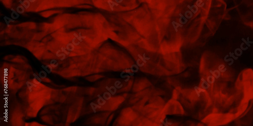 red smoke abstract background. Mystical swirling smoke rolling low across the ground. Abstract background of chaotically mixing puffs of smoke on a dark background Selective focus. Toned. 