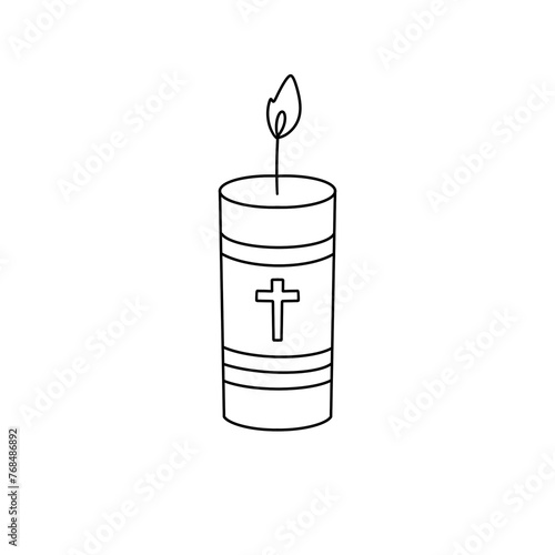 A candle with a cross on it