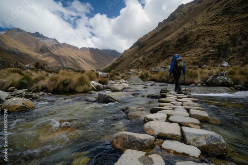 lone trekker crossing a mountain stream on stepping stones
