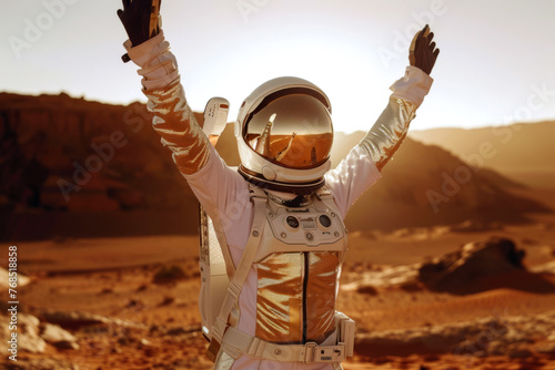 Astronaut joyfully raises his hands in the desert on mars. Concept of mars exploration. photo