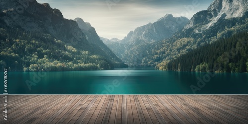 A tranquil lake and towering mountains form the backdrop to an empty wooden tabletop, beckoning viewers to embrace the tranquility of the natural world. photo