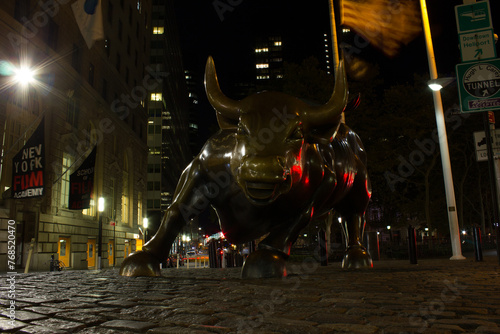 Charging Bull in Lower Manhattan is a symbol of "aggressive financial optimism and prosperity" in New York, New York.