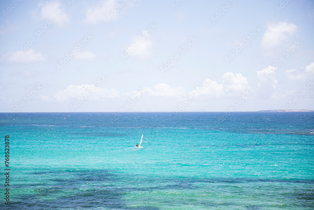 Wide Angle View of Sailboat in Caribbean, Blue Water Wide Angle View of Sailboat in Caribbean, Blue Water