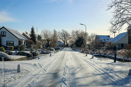 Snow and ice on the streets in NIeuwerkerk aan den IJssel photo