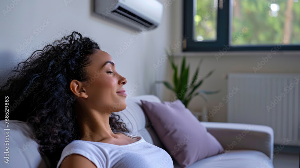 The air conditioner is on the wall. The air conditioner is on the wall.