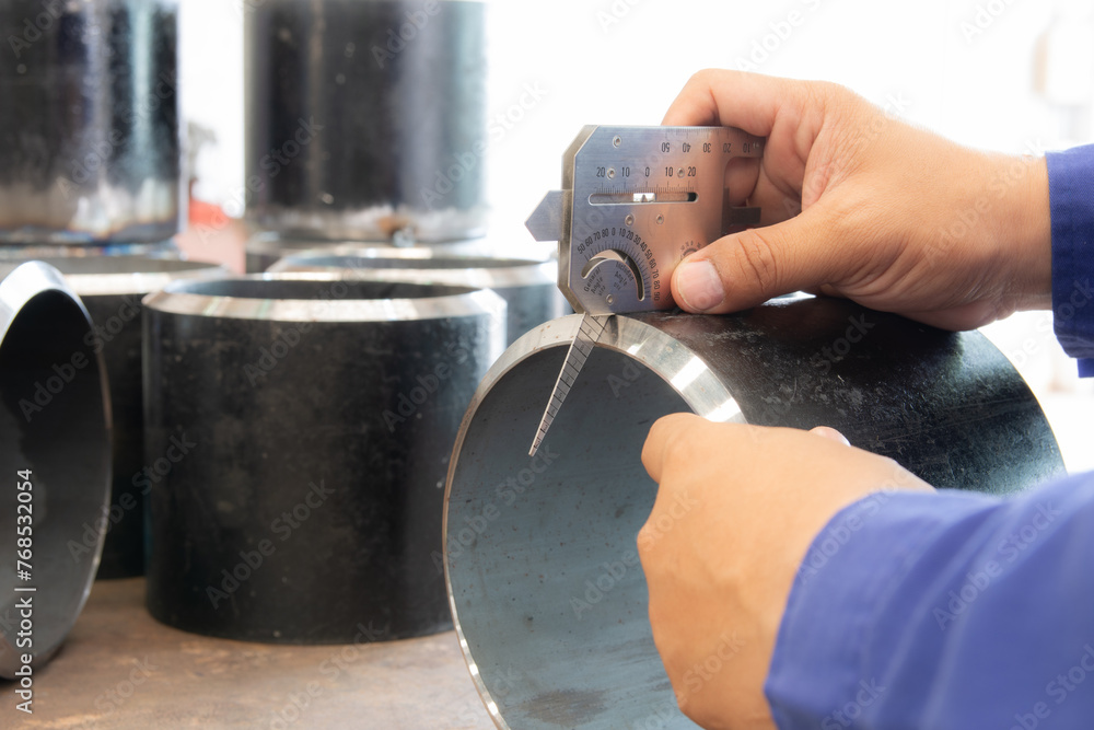 QC inspector measure the bevel angle with Multi Welding Gauge. Welding Gauge is a measuring tool
