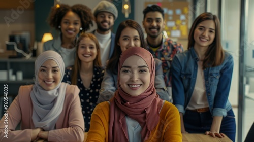 A multicultural group of friends laughing and enjoying each other, diversity and inclusion in the workplace © CYBERUSS